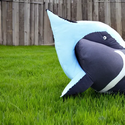 Prompt: ikea shark plush blahaj on a grass field