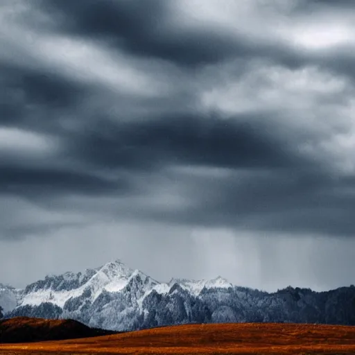 Image similar to mountains made of ligh under a bright cloudy sky, grainy photograph