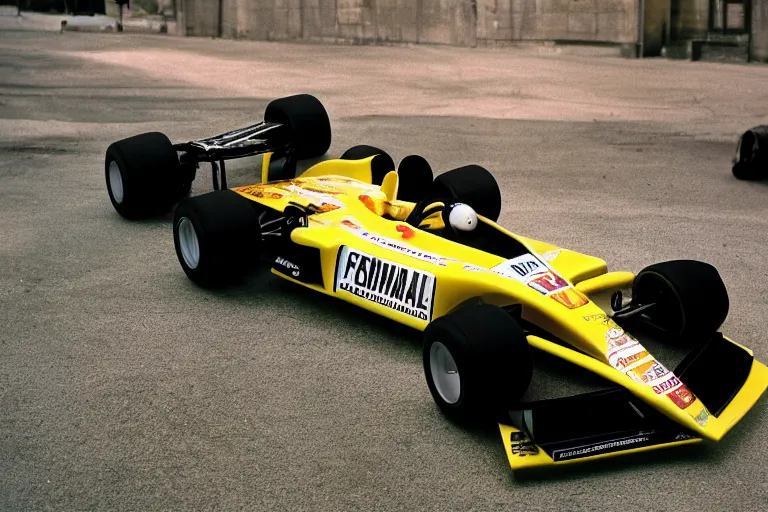 Prompt: a photograph of a formula one car sponsored by a banana company, wide angle lens, fujifilm, 24mm, fuji velvia, dramatic lighting