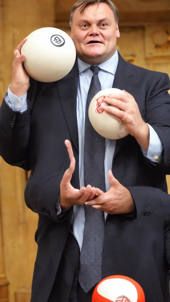 Image similar to ed balls, holding balls