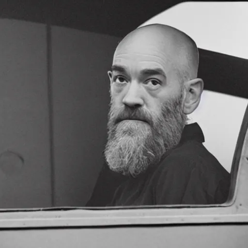 Image similar to photograph of michael stipe driving a train