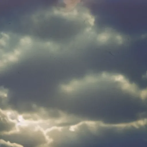 Image similar to a professional studio photograph (((((((((((((((of a 90s television and VHS combo playing a video))))))))))))))) of clouds, key light, 50mm, shallow depth of field, no artefacts