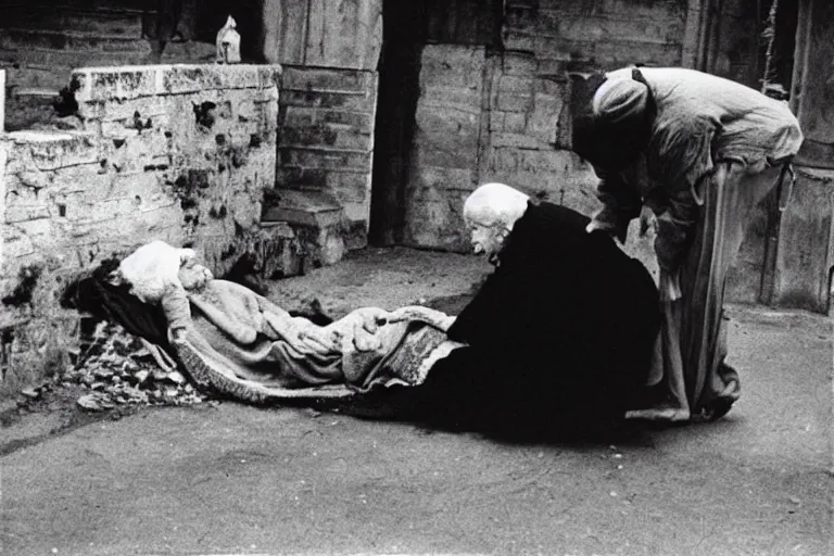 Image similar to death comes for an elderly lady. 1 9 6 9 black and white photo.