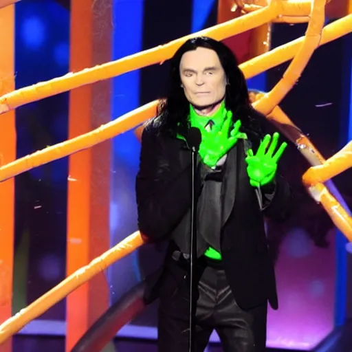 Prompt: Tommy Wiseau gets slimed at the Kid's choice awards