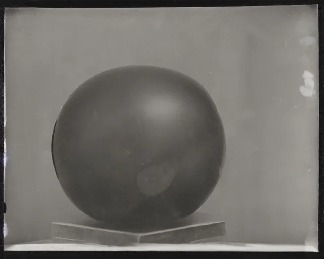 Image similar to a black and white photo of a person in a ball, a marble sculpture by Dora Maar, featured on flickr, new objectivity, tintype photograph, ambrotype, calotype