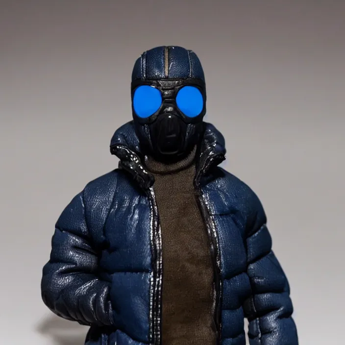 Image similar to a action figure of kanye west using a full face covering black mask, a small, tight, undersized reflective bright blue round puffer jacket made of nylon, dark jeans pants and big black balenciaga rubber boots, figurine, detailed product photo