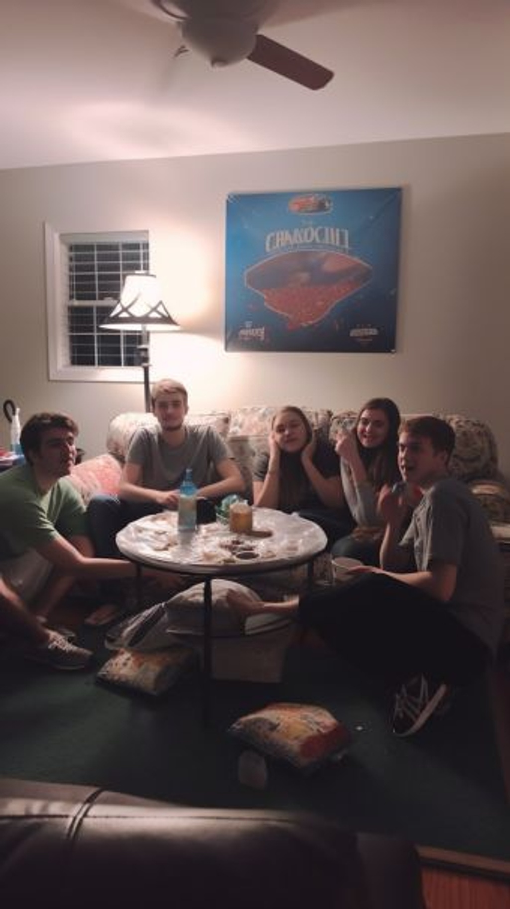 Prompt: scene set in a 90s living room :: 5, where a group of friends :: 4 are sitting in a 90s-themed living room :: 4. They are gathered around an old large standard TV :: 3 playing a badly-pixeled wrestling game :: 4 while enjoying pizza :: 3 and having a good time :: 4 --ar 9:16 --q 2 --upbeta --v 5