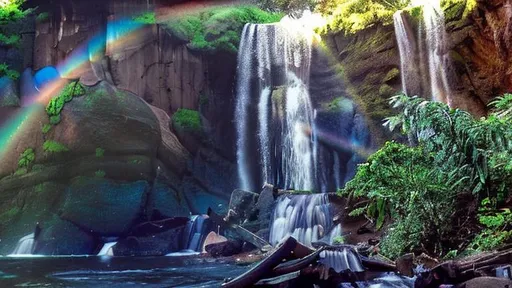 Prompt: A beautiful waterfall with a rainbow