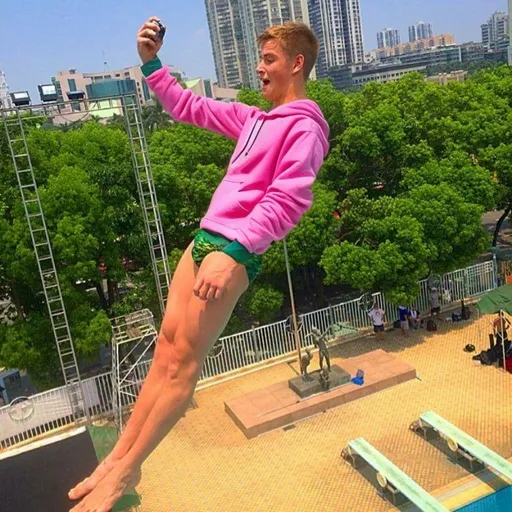 Prompt: teenage boy wearing a pink hoodie