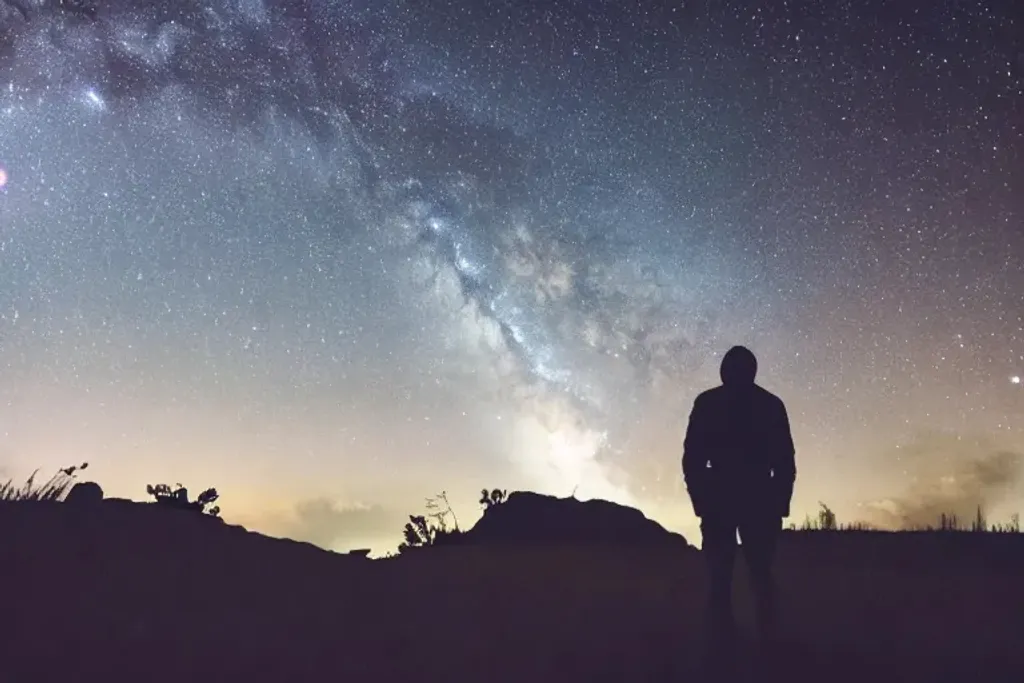 Prompt: a man alone in the dark night on a hill looking at the stars