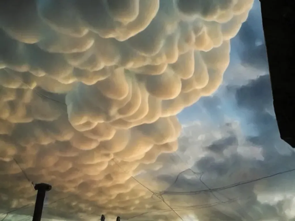 Prompt: Large mammatus clouds in the sunset sky, fantasy art trending on ArtStation
