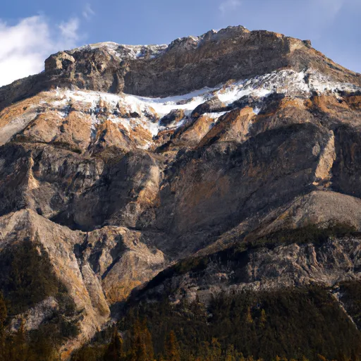 Prompt: a tall rocky mountain in fall. peak covered in snow. canada. realistic. realism. photolike.