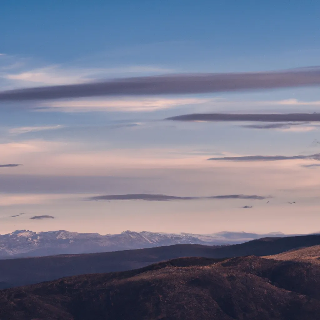 Prompt: Beautiful mountain range. early in the morning. cinematic. cirrus clouds. landscape photography. early purple sky