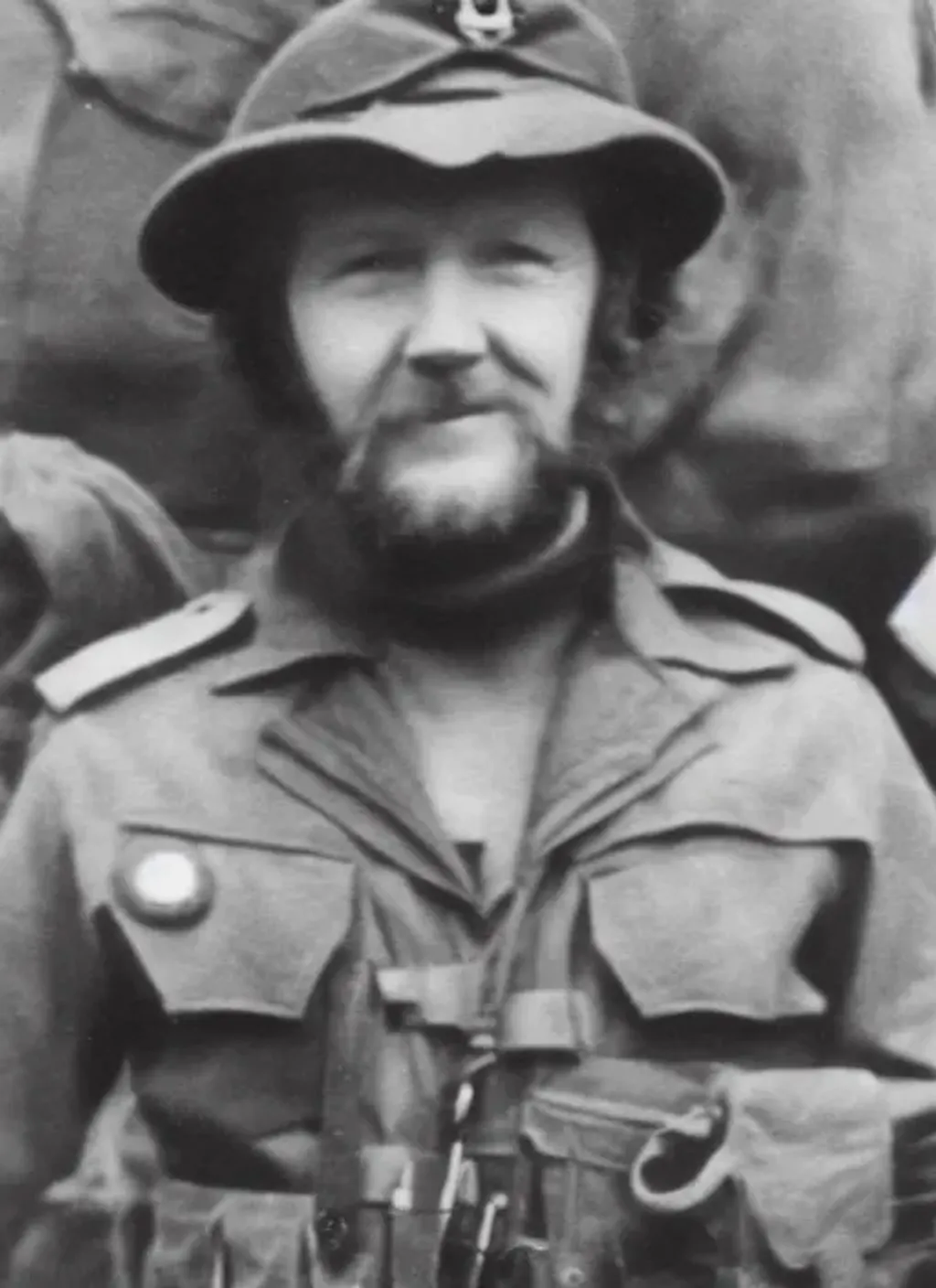 Prompt: Photograph of Bill Oddie as a soldier in World War II, black and white