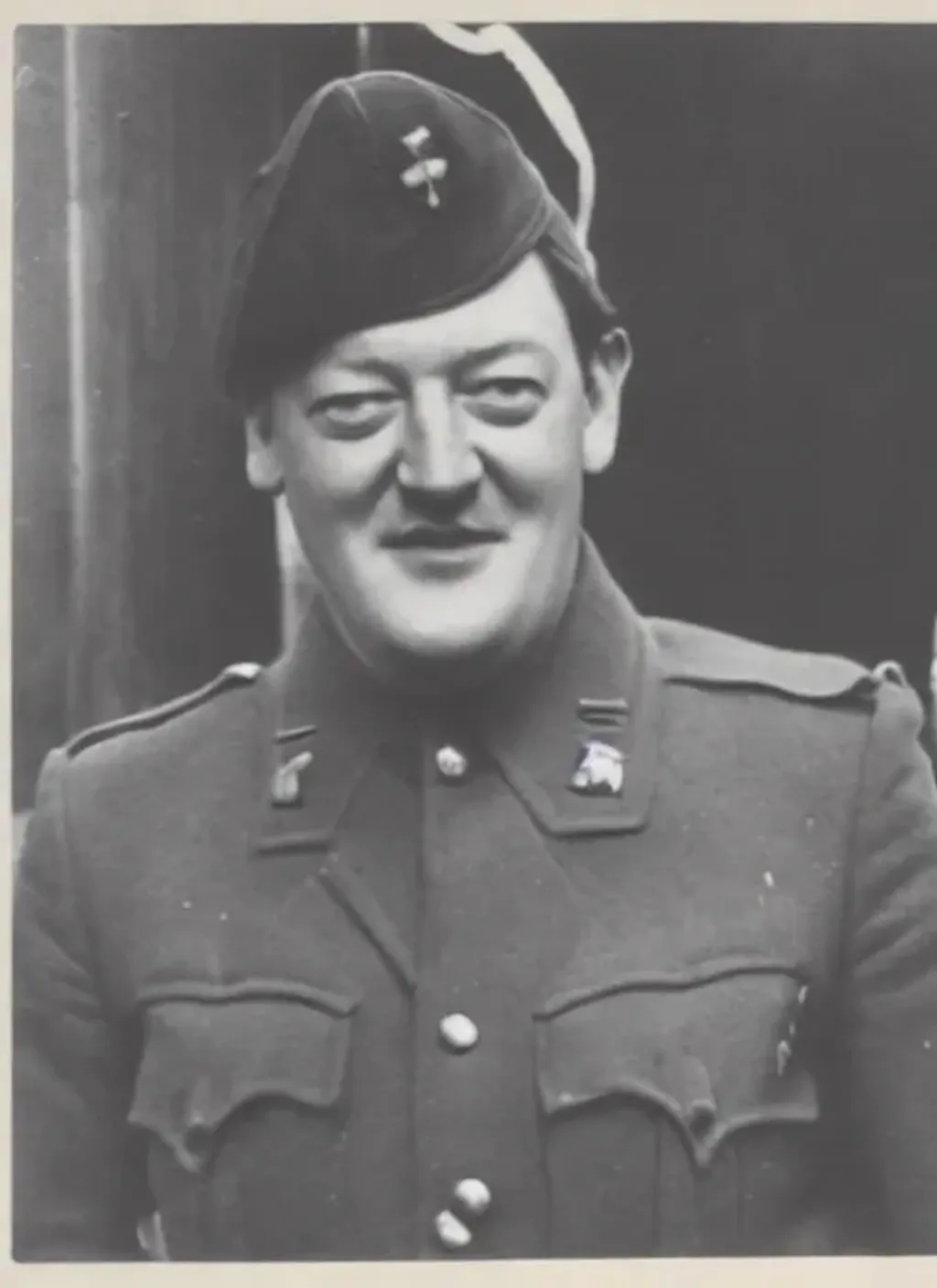 Prompt: Photograph of Stephen Fry as a soldier in World War II, black and white