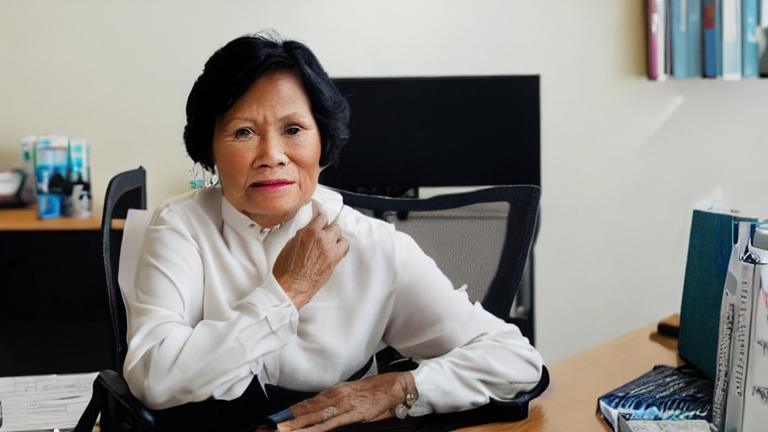 a-60-year-old-beautiful-filipino-woman-sitting-on-he