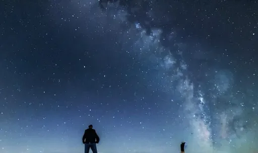 Prompt: man alone under starry night sky